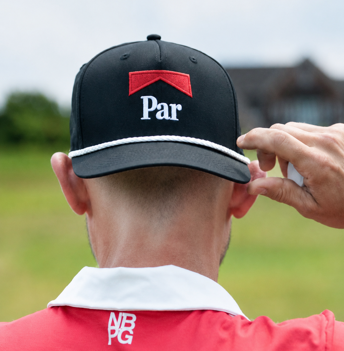 A stylish Parboro golf rope hat by Not Bad Pretty Good featuring a woven brim and rope detail, perfect for sunny outdoor golf courses.