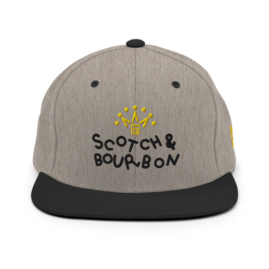 Heather black Scotch & Bourbon golf snapback hat by Not Bad Pretty Good with front logo and adjustable strap.