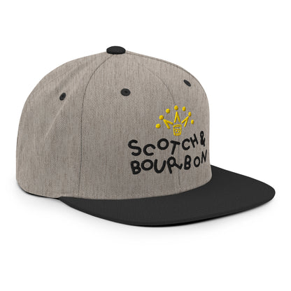 Heather black Scotch & Bourbon golf snapback hat by Not Bad Pretty Good, showing the front and side view with logo details